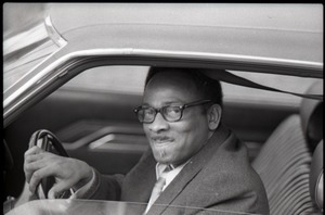 African American driver looking out his car window