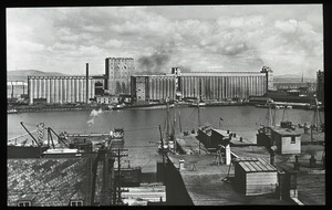 Grain silos along a river