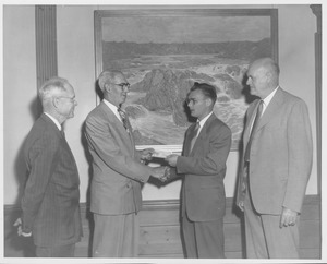 Ralph A. Van Meter with three men during presentation of scholarship