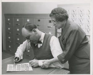 Johanna Olchewsky teaching left-hand writing to a man missing his right hand