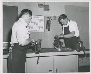 Two men in machine shop