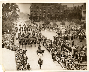 General Edward Lawrence Logan and staff passing the Masschusetts State House and governor's viewing stand in the Victory Parade