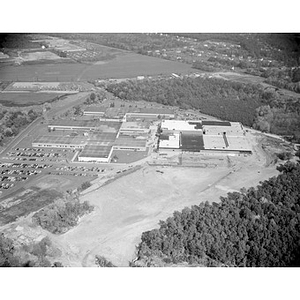 Suburban location of industrial buildings, some new construction, unidentified