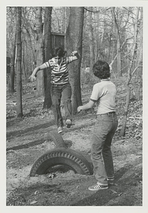 A Student Jumping on Tires at Freshman Camp