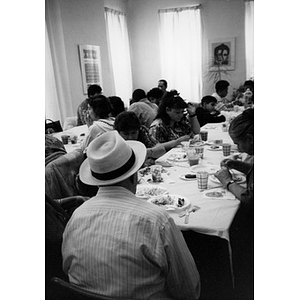 Community members sharing a meal at Inquilinos Boricuas en Acción headquarters.