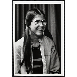 A teenage girl from the Boys' Clubs of Boston wearing glasses