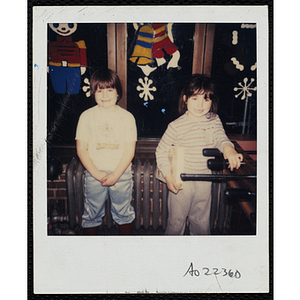 Two girls pose at a Christmas party