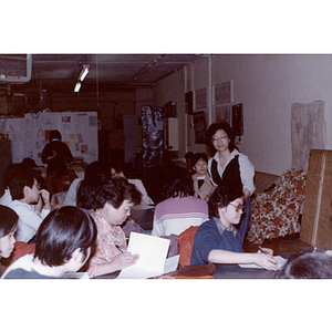 Adults in a English-language class given by the Chinese Progressive Association