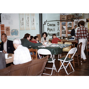 Guests eating at a slide presentation on the Bakke Decision