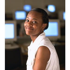 Co-op student seated in front of computers