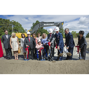 A group shovels dirt at the groundbreaking ceremony for the George J. Kostas Research Institute for Homeland Security