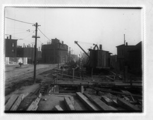 View of construction showing wood beams and a crane