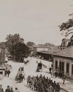 View from above of German prisoners marching through a busy town street