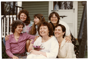 Group of women seated on a front steps of a house (Grace Gershuny, back row, far right)
