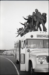 Free Spirit Press crew on top of their bus: view from front of the bus with Spirit in Flesh sign