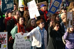 Anti-war protesters marching in the streets: rally and march against the Iraq War