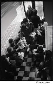 Protester distributing literature during the occupation of the University Placement Office, Boston University, opposing on-campus recruiting by Dow Chemical Co.