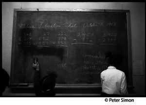 Children at the chalkboard, Liberation School, Boston, Mass.