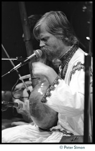 Bhagavan Das on stage with dotara at Zellerbach Hall, U.C. Berkeley