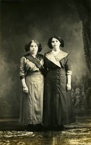 Weronika Skedzielewski (right) and unidentified woman: full-length studio portrait, arm in arm