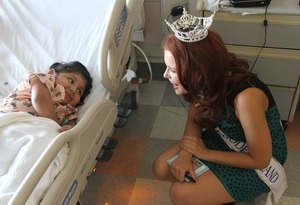 Miss Rhode Island, Ivy DePew, chats with Deborah Morente Gomez, in her room at Hasbro Children's Hospital