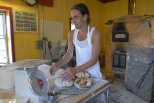 Hungry Ghost Bread: owner and baker Jonathan C. Stevens with fresh-baked bread