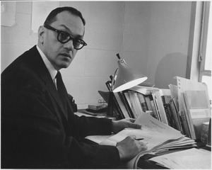 Irving P. Rothberg working at desk