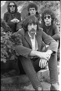 The Velvet Underground: (l.-r.) Maureen Tucker, Lou Reed, Doug Yule, and Sterling Morrison (front) posing in a circle garden