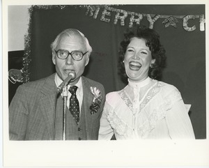 Unidentified man and woman at Christmas party
