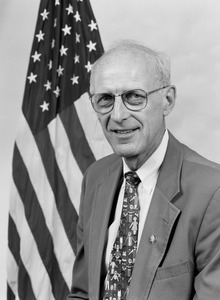 Congressman John W. Olver: studio portrait with U.S. flag