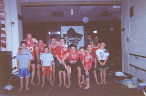 Springfield College men's gymnastics team with children
