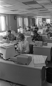 Unidentified call center workers in Boston Police Dispatch Operations Center