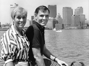 Mayor Raymond L. Flynn and his wife Catherine (Kathy) sitting at the East Boston waterfront with Boston Harbor in the background