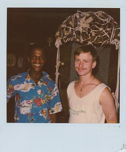 A Photograph of Marsha P. Johnson Wearing a Hawaiian Shirt Standing Next to Willie Brashears