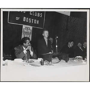 A boy speaks from the podium at an awards event held by the Boys' Clubs of Boston and the Knights of Columbus Bunker Hill Council