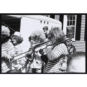 Two Hills Mills Crown Band members playing their instruments at the Boys and Girls Clubs of Boston 100th Anniversary Celebration Parade