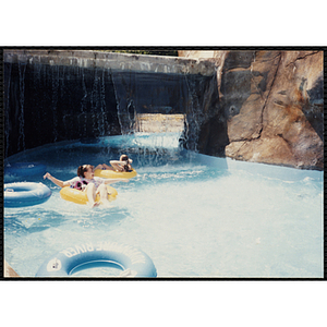 Two girls ride in intertubes at Water Country water park during a Tri-Club field trip