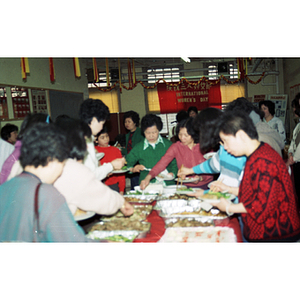 Guests eating at an International Women's Day event