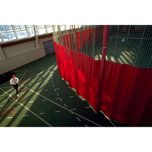 Male runner practicing on indoor track