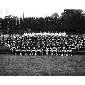 Football team photo on bleachers