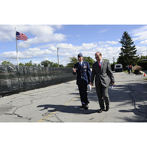 Lieutenant General Ted F. Bowlds and President Joseph E. Aoun walk to the groundbreaking ceremony for the George J. Kostas Research Institute for Homeland Security, located on the Burlington campus of Northeastern University