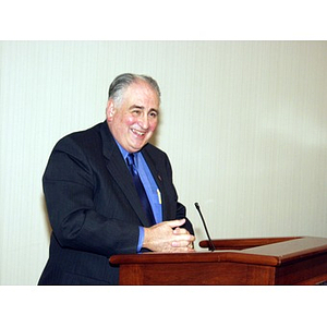 Harry P. Keegan III, CBA '64, speaking at podium after receiving College of Business Administration Distinguished Service Award