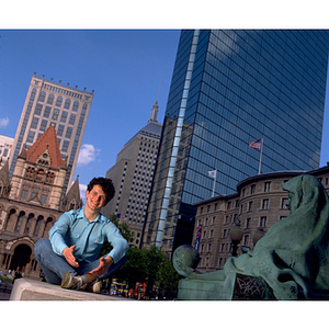 A student sitting outside the Boston Public Library