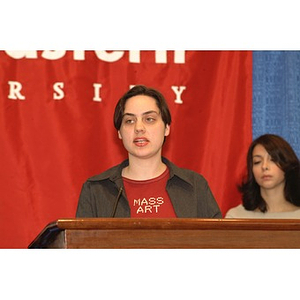 A student from Mass Art speaks at the podium during a press conference on student aid