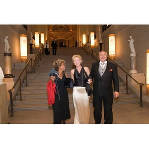 Three people in the Museum of Fine Arts for President Aoun's inauguration celebration