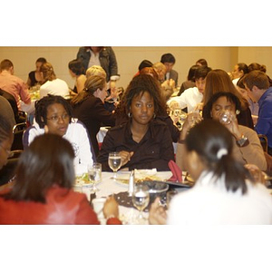 Ademide Adelusi-Adeluyi and friends dining together at the Student Activities Banquet