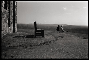 Two women looking out from an overlook, possibly at Quabbin Reservoir