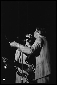 Paul McCartney and John Lennon (the Beatles) in concert at D.C. Stadium