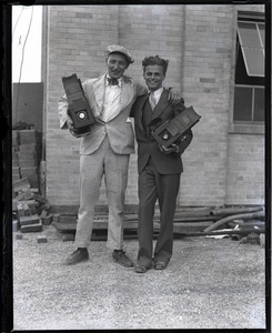 Jack Dixon (left) and unidentified colleague posed with their Graflex cameras