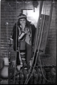 Wedding of Jim and Anne Baker: Joe Podlesny seated on curtain blocks